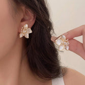 Women's Ear Studs in Floral Design with Heart Detail and Pearl-like Petals