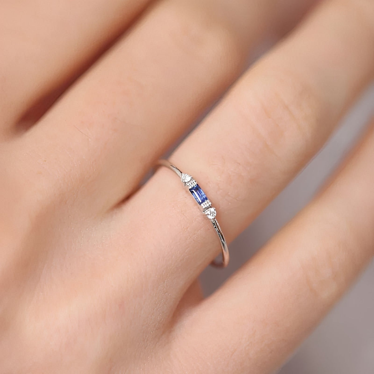 Women's Ring with Baguette Detail and Side Stone Accents