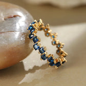 Women's Ring with Scattered Square Stone Accents and Offset Design