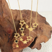 Women's Star Necklace with Various Charms and Asymmetrical Star Design