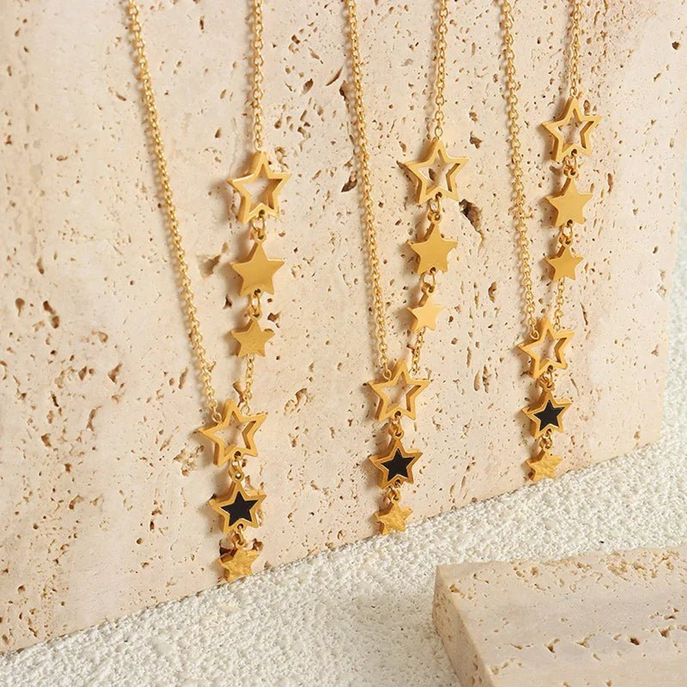 Women's Star Necklace with Various Charms and Asymmetrical Star Design