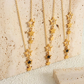 Women's Star Necklace with Various Charms and Asymmetrical Star Design